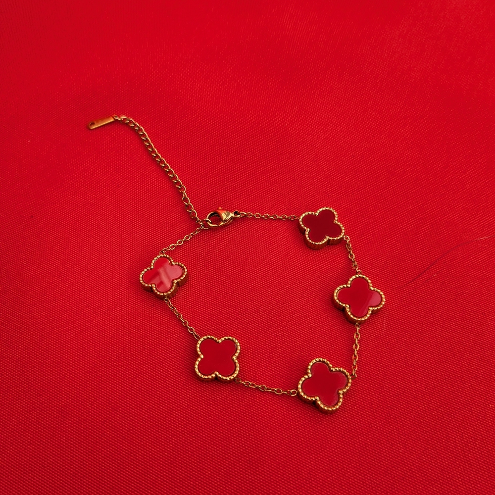 Elegant Gold and Red Clover Bracelet